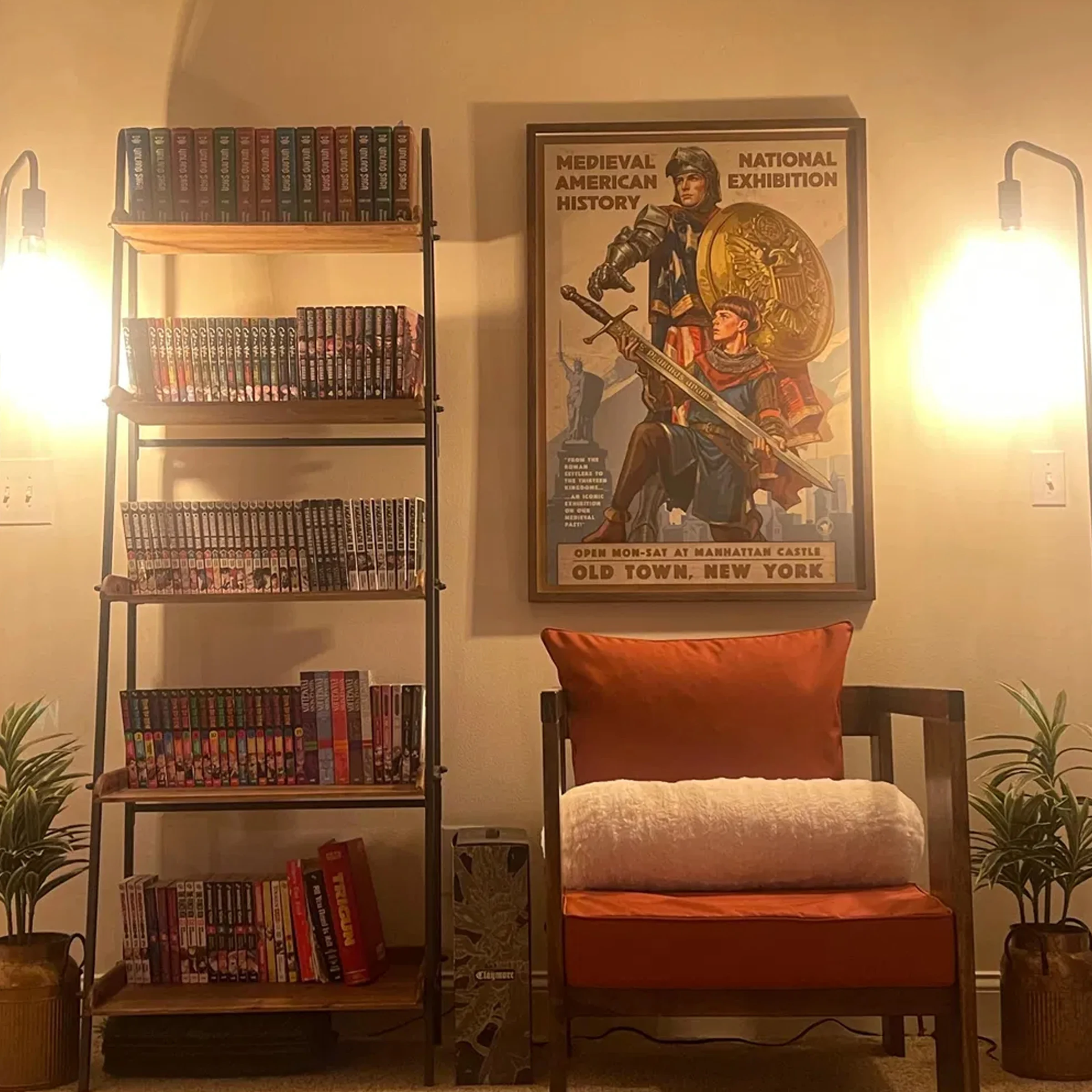 American Kingdoms example: The framed American Kingdoms exhibition print displayed beside a bookcase and reading chair